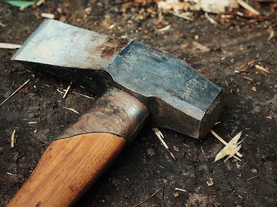 gray and brown axe on brown log