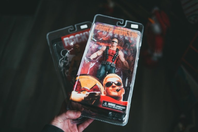 Crop person demonstrating toy of comic character